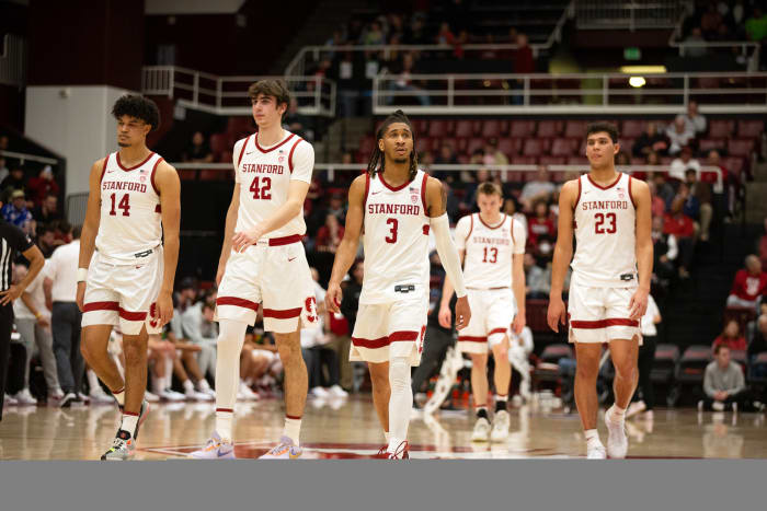Feb 22, 2024; Stanford, California, USA; The Stanford Cardinal starting five forward Spencer Jones (14), forward Maxime Raynaud (42), guard Kanaan Carlyle (3), guard Michael Jones (13) and forward Brandon Angel (23) walk back onto the court follow a timeout during the first half against the Oregon Ducks at Maples Pavilion. Mandatory Credit: D. Ross Cameron-USA TODAY Sports